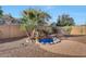 Backyard water feature with stone accents surrounded by desert landscaping at 29681 W Amelia Ave, Buckeye, AZ 85396