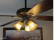 Modern ceiling fan with three lights providing efficient air circulation and ample illumination at 3212 E Constance Way, Phoenix, AZ 85042