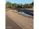 Picturesque community canal with a paved walking path, offering scenic views at 3212 E Constance Way, Phoenix, AZ 85042