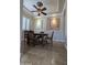 Elegant dining room features a wooden table, neutral walls, and decorative light fixture at 3212 E Constance Way, Phoenix, AZ 85042