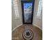 Elegant entryway with a decorative iron door, shuttered windows, and inlaid tile floor at 3212 E Constance Way, Phoenix, AZ 85042