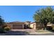 Lovely home with a circular driveway, desert landscaping, and attached garages at 3212 E Constance Way, Phoenix, AZ 85042