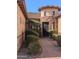 Charming home entrance with a unique turret, brick pathway, and beautifully landscaped yard at 3212 E Constance Way, Phoenix, AZ 85042