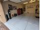 Spacious two-car garage with epoxy floor and ample storage, lighting and equipment at 3212 E Constance Way, Phoenix, AZ 85042