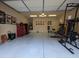 Spacious garage featuring ample storage, a workout area, and epoxy flooring, offering both functionality and style at 3212 E Constance Way, Phoenix, AZ 85042