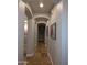 Hallway features tile flooring, neutral walls and arched entryways at 3212 E Constance Way, Phoenix, AZ 85042