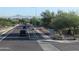 Street view showing the neighborhood's bike-friendly lanes and sidewalks, with distant mountain views at 3212 E Constance Way, Phoenix, AZ 85042