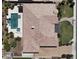 Aerial view of custom home showcasing backyard pool and spa, desert landscaping, and tile roof at 3464 E Dartmouth St, Mesa, AZ 85213