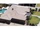 Overhead shot of home with a pool, well manicured landscaping, 3 car garage, and tile roof at 3464 E Dartmouth St, Mesa, AZ 85213