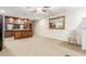 Bonus room featuring a bar area with wooden cabinets and a large mirror at 3464 E Dartmouth St, Mesa, AZ 85213