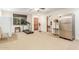 Spacious bonus room featuring gym equipment, a refrigerator, and wood accents at 3464 E Dartmouth St, Mesa, AZ 85213