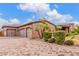 Spacious home with a large three-car garage and brick-paved driveway, adorned with palm trees at 3464 E Dartmouth St, Mesa, AZ 85213