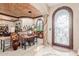 Elegant foyer with decorative glass door, stone column and stylish furnishings visible in the living room at 3464 E Dartmouth St, Mesa, AZ 85213