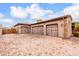 Three-car garage with ample parking space and durable brick-paved driveway, lovely palm tree at 3464 E Dartmouth St, Mesa, AZ 85213