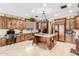Spacious kitchen features custom wood cabinets, granite countertops, and a large central island at 3464 E Dartmouth St, Mesa, AZ 85213