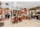 Spacious kitchen features custom wood cabinets, granite countertops, and a large central island at 3464 E Dartmouth St, Mesa, AZ 85213