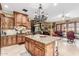 Spacious kitchen features custom wood cabinets, granite countertops, and a large central island at 3464 E Dartmouth St, Mesa, AZ 85213