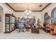 Open living room offers bookshelves, unique decor, and a relaxing atmosphere at 3464 E Dartmouth St, Mesa, AZ 85213