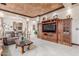 Spacious living room with an entertainment center and rustic wood coffee table at 3464 E Dartmouth St, Mesa, AZ 85213