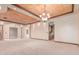 Spacious living room with unique ceiling design, columns, and built-in bar area at 3464 E Dartmouth St, Mesa, AZ 85213