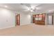 Large living room with a custom wet bar and ample space for entertaining at 3464 E Dartmouth St, Mesa, AZ 85213