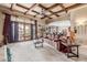 Expansive living room with coffered ceilings, large windows, and comfortable seating at 3464 E Dartmouth St, Mesa, AZ 85213