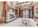 Bright living room with a fireplace, built-in shelving, and coffered ceilings at 3464 E Dartmouth St, Mesa, AZ 85213