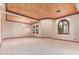 An open living room with architectural details, abundant natural light, and a neutral color palette at 3464 E Dartmouth St, Mesa, AZ 85213