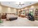 Spacious main bedroom boasts carpeted floors, recessed lighting, and a ceiling fan for ultimate comfort at 3464 E Dartmouth St, Mesa, AZ 85213