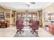 Bright office features marble floors, a glass table, and French doors to the outside patio at 3464 E Dartmouth St, Mesa, AZ 85213