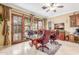 Bright office features marble floors, a glass table, and French doors to the outside patio at 3464 E Dartmouth St, Mesa, AZ 85213