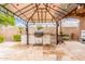 The outdoor kitchen is equipped with a built-in grill, counter space, and decorative lighting for entertainment at 3464 E Dartmouth St, Mesa, AZ 85213