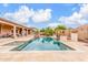 The pool and spa area blends seamlessly with the landscaped backyard, creating a private retreat for outdoor living at 3464 E Dartmouth St, Mesa, AZ 85213