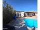 Backyard showcasing a sparkling pool, patio area, and fenced perimeter at 350 N 9Th St, Coolidge, AZ 85128