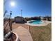 Large backyard with a pool and a storage shed at 350 N 9Th St, Coolidge, AZ 85128