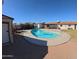 Expansive backyard featuring a refreshing pool area and a grassy lawn at 350 N 9Th St, Coolidge, AZ 85128