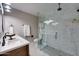 Bright bathroom features a glass shower with marble tile, a double vanity, and modern fixtures at 350 N 9Th St, Coolidge, AZ 85128