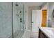 Modern bathroom with glass-enclosed shower, marble tile, and stylish fixtures at 350 N 9Th St, Coolidge, AZ 85128