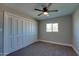 Bedroom with neutral walls, ceiling fan, carpet, window, and closet at 350 N 9Th St, Coolidge, AZ 85128