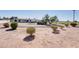 Exterior view of single-story house with circular driveway and well-maintained landscaping at 350 N 9Th St, Coolidge, AZ 85128