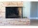 Close-up of a brick fireplace with a clean hearth and fire-burning area at 350 N 9Th St, Coolidge, AZ 85128