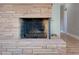 Brick fireplace with a visible fire-burning area at 350 N 9Th St, Coolidge, AZ 85128