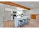 Kitchen featuring white cabinets, quartz counters, stainless appliances, hardwood floors, and a center island at 350 N 9Th St, Coolidge, AZ 85128