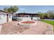 Outdoor patio area with a pergola, brick pavers, and manicured landscape at 350 N 9Th St, Coolidge, AZ 85128