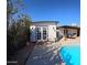 Relaxing poolside view, featuring the guest house and patio seating at 350 N 9Th St, Coolidge, AZ 85128