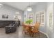 Cozy dining area with natural light, wood floors and open to the living room at 3602 W Barcelona Dr, Chandler, AZ 85226