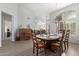 Open concept dining room with plenty of room to gather and wood laminate flooring at 3602 W Barcelona Dr, Chandler, AZ 85226