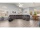 Bright open concept living room featuring vaulted ceilings, neutral walls, and wood laminate flooring at 3602 W Barcelona Dr, Chandler, AZ 85226