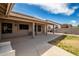 Covered patio with a seating area, barbecue grill, and a well-maintained backyard with block wall fencing at 3602 W Barcelona Dr, Chandler, AZ 85226