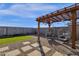 Relaxing backyard seating area with pergola at 36243 W San Clemente Ave, Maricopa, AZ 85138